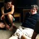 Carlyn Moulton, who started PEC Syria, shares a joke with Ahmed (foreground) and Slieman during a drop-by visit to the house.